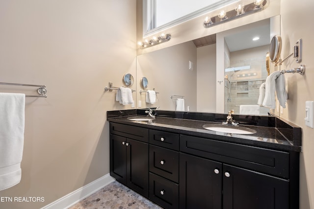 bathroom featuring vanity and a shower with shower door