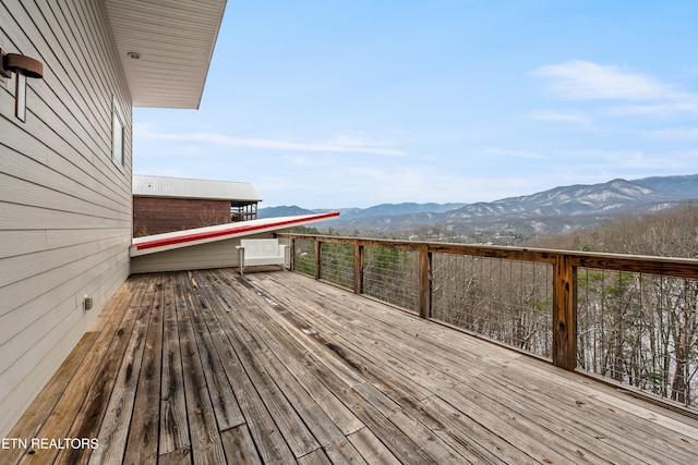 wooden terrace with a mountain view