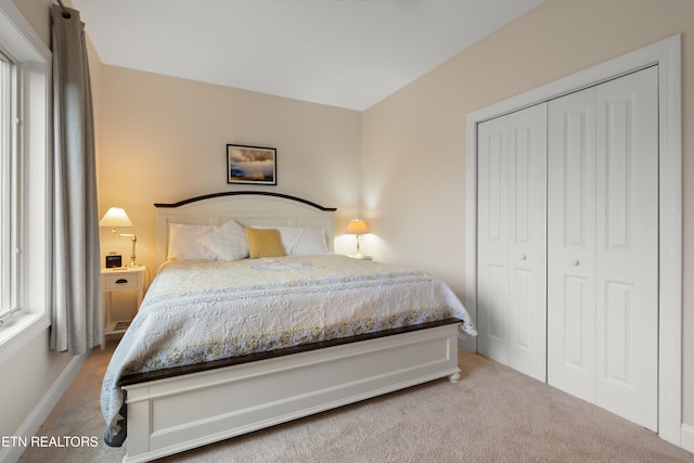 bedroom featuring a closet and carpet