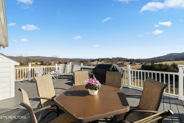 wooden deck featuring outdoor dining space