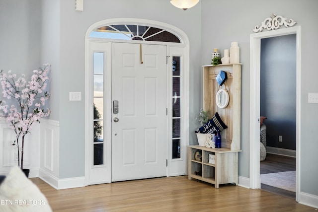 entryway with wood finished floors