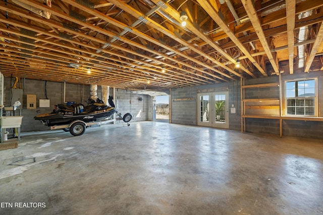 garage featuring french doors and a sink