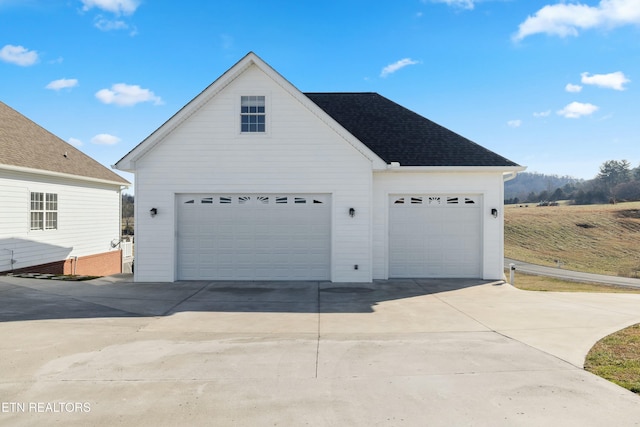 garage featuring driveway