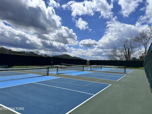 view of sport court with fence