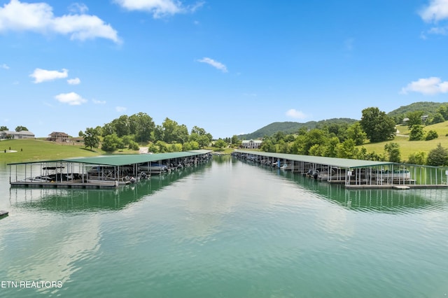 property view of water featuring a mountain view and a floating dock