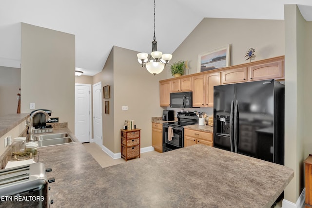 kitchen featuring black appliances, a sink, light brown cabinetry, a chandelier, and lofted ceiling