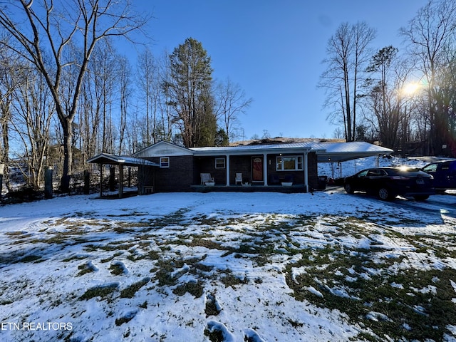 view of front of home featuring a carport