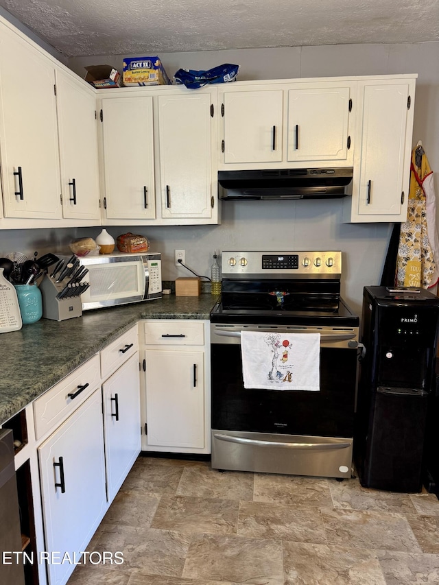 kitchen featuring dark stone countertops, stainless steel electric range oven, a textured ceiling, and white cabinets