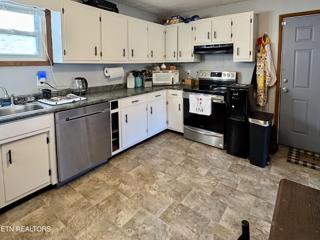 kitchen with sink, stainless steel appliances, and white cabinets