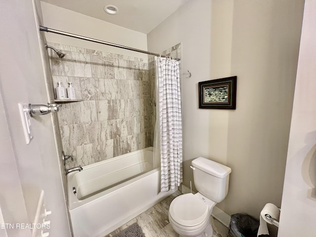 bathroom with toilet, hardwood / wood-style flooring, and shower / bathtub combination with curtain