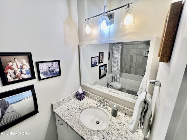 full bathroom featuring toilet, vanity, and shower / bath combination with curtain