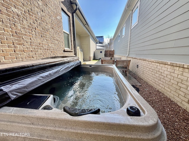 view of pool featuring a hot tub