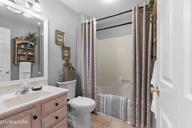 full bathroom with toilet, a textured ceiling, shower / bath combination with curtain, tile patterned floors, and vanity