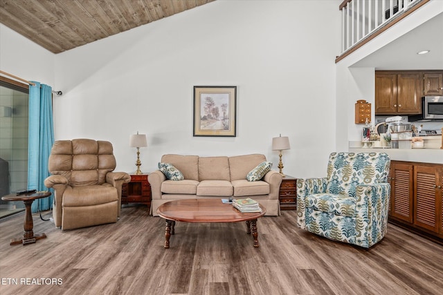 living room featuring wood ceiling, vaulted ceiling, and hardwood / wood-style flooring