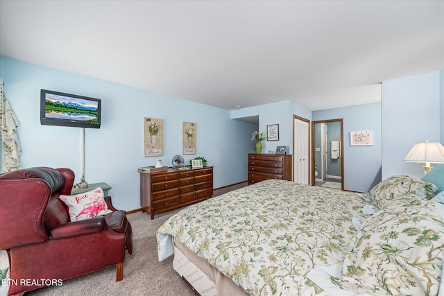 bedroom featuring a closet and carpet flooring