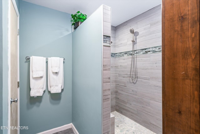 bathroom with tiled shower