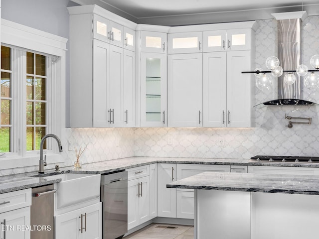 kitchen featuring light stone counters, appliances with stainless steel finishes, backsplash, and white cabinetry