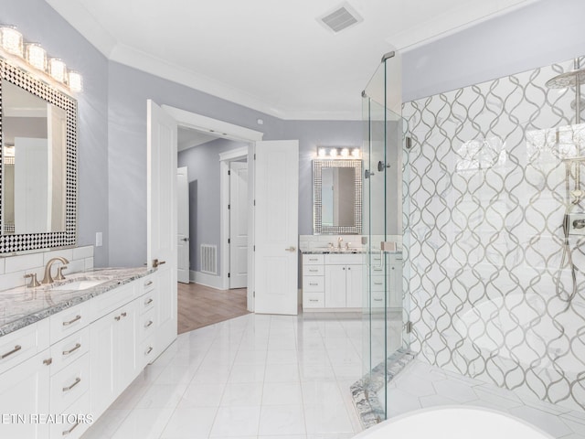 bathroom featuring ornamental molding, separate shower and tub, and vanity