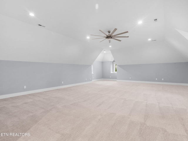 bonus room featuring vaulted ceiling, ceiling fan, and light carpet