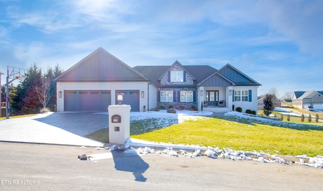 view of front of property with a front lawn and a garage