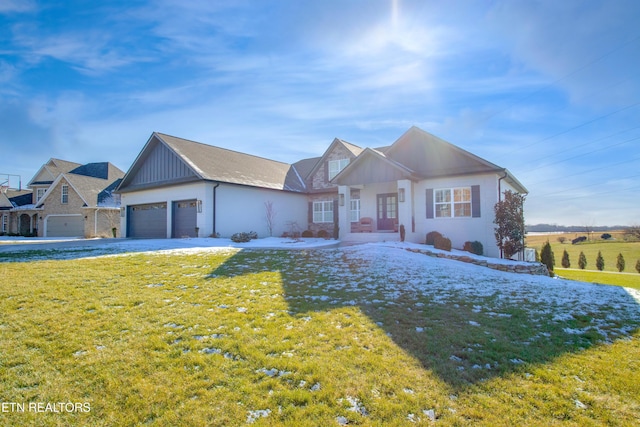 view of front of house featuring a front lawn and a garage