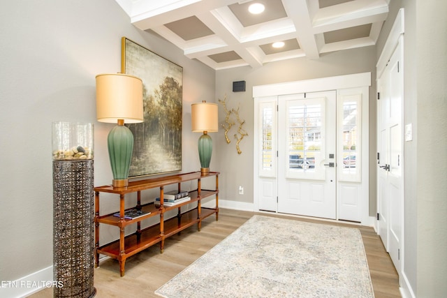 foyer featuring hardwood / wood-style flooring, beam ceiling, and coffered ceiling