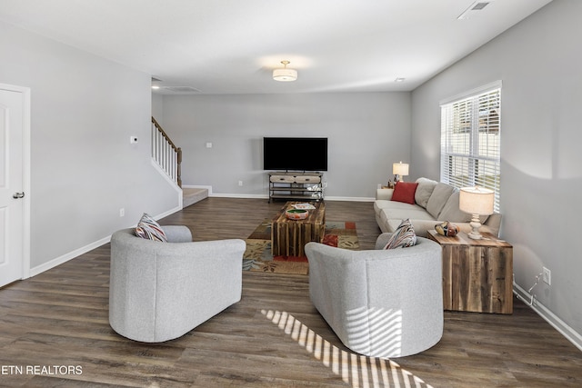 living room featuring dark hardwood / wood-style flooring