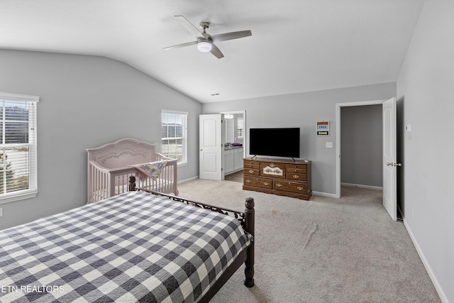 bedroom with lofted ceiling, light colored carpet, and ceiling fan