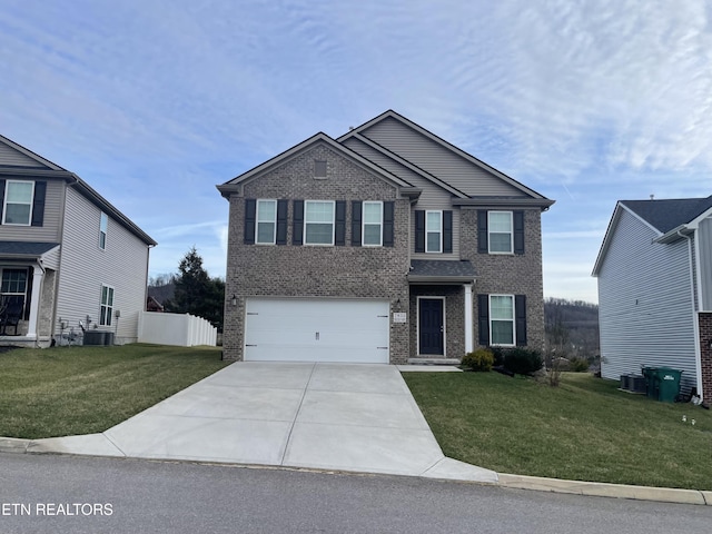 view of front of house with a front yard, a garage, and cooling unit