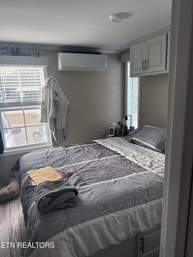 bedroom with a wall mounted air conditioner