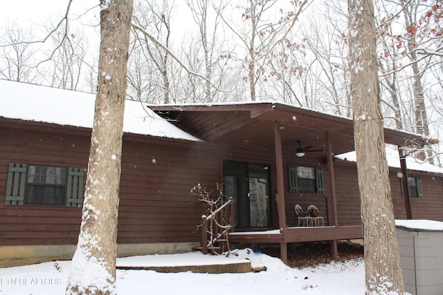 exterior space featuring ceiling fan