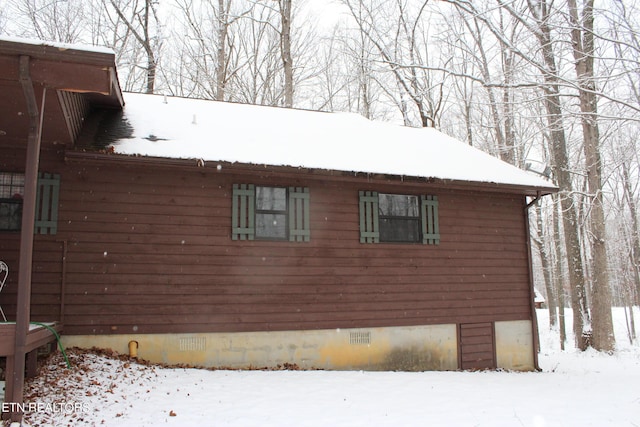 view of snow covered property