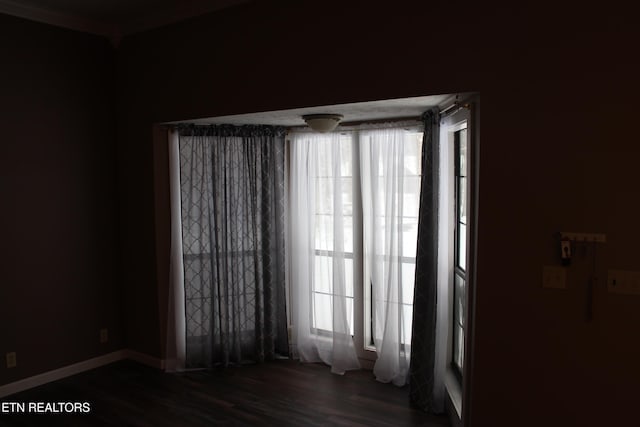 spare room featuring dark hardwood / wood-style floors