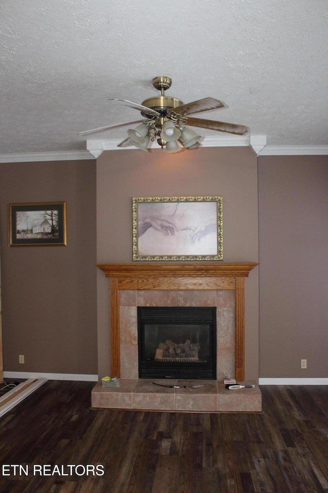 room details with a textured ceiling, ornamental molding, and a tile fireplace