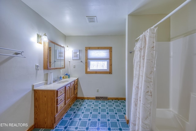 bathroom with vanity and a shower with shower curtain