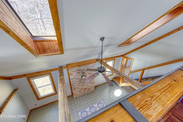 details with ceiling fan and a skylight