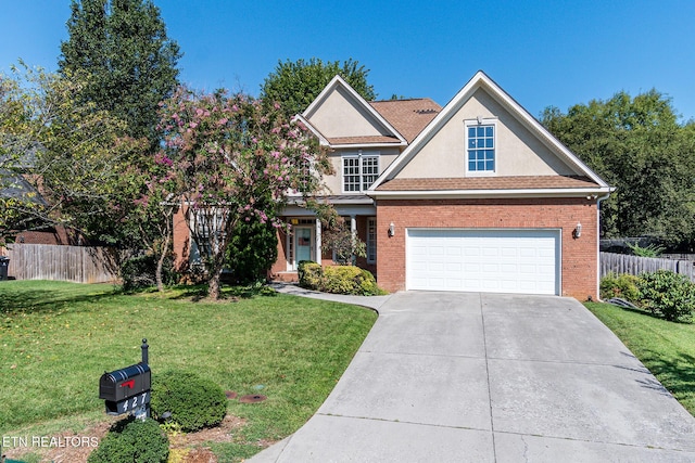 view of front of home with a front yard and a garage