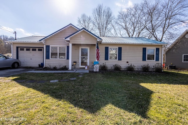 single story home featuring a garage, central AC, and a front lawn