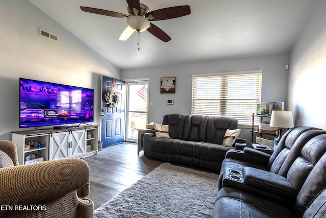 living room featuring hardwood / wood-style flooring, vaulted ceiling, and ceiling fan