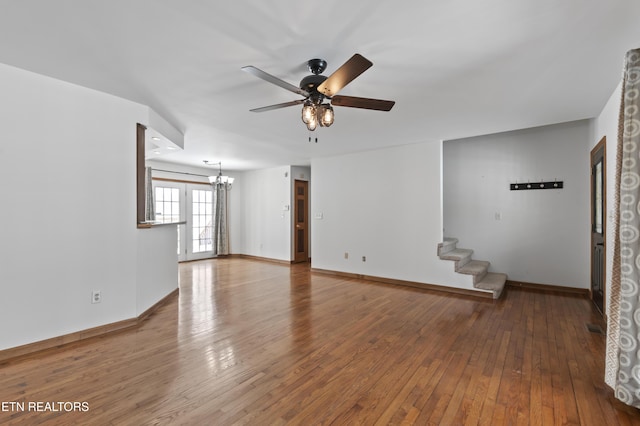 unfurnished living room with ceiling fan and hardwood / wood-style flooring