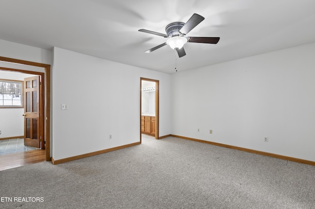 carpeted empty room with ceiling fan