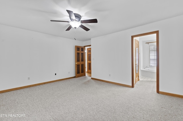 empty room featuring light carpet and ceiling fan