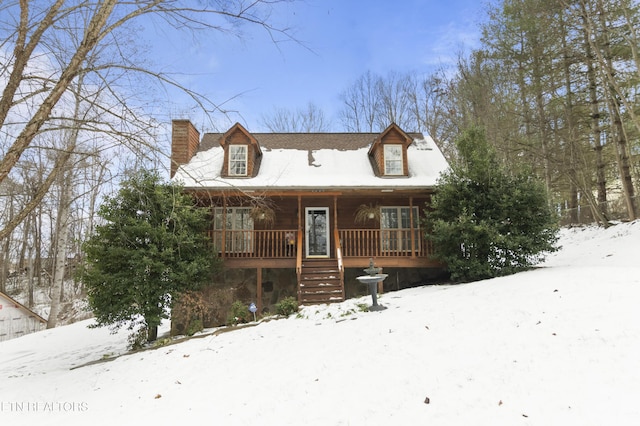 cabin featuring a porch