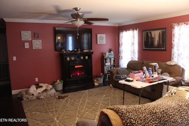 living room with a fireplace, ceiling fan, and crown molding