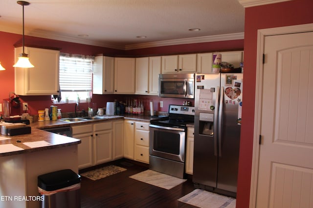 kitchen featuring stainless steel appliances, sink, hanging light fixtures, crown molding, and dark wood-type flooring