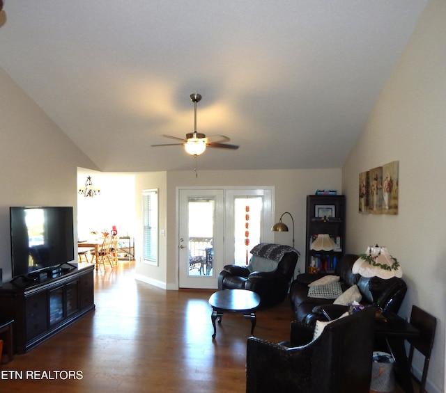 living room featuring ceiling fan, dark hardwood / wood-style flooring, and lofted ceiling