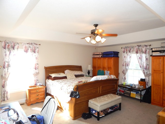 bedroom featuring light carpet and ceiling fan