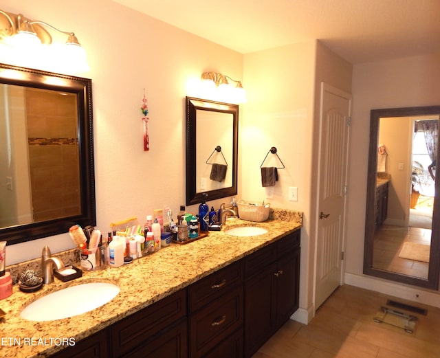 bathroom featuring vanity and tile patterned flooring