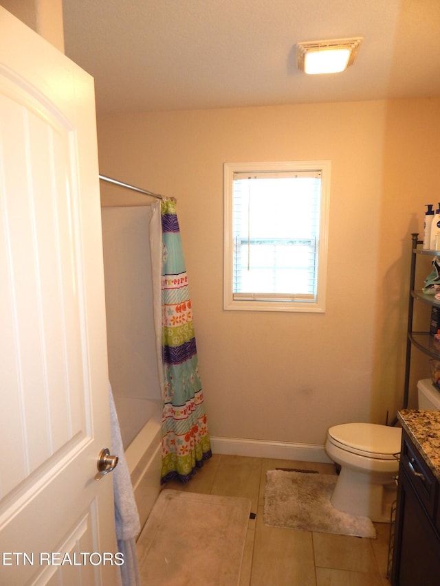 full bathroom with toilet, shower / bathtub combination with curtain, tile patterned floors, and vanity