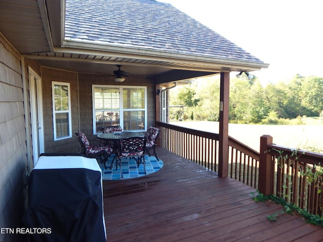 deck with ceiling fan and a grill